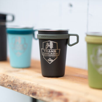 Earthwell pint cups showcasing blue, black, and green color options.